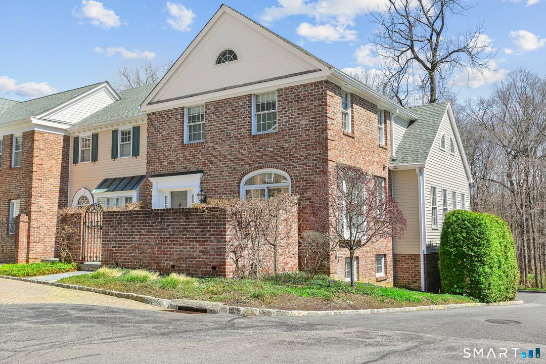 Experience the pinnacle of urban sophistication in this beautifully updated and meticulously maintained end unit townhome, right in the center of historic Ridgefield !