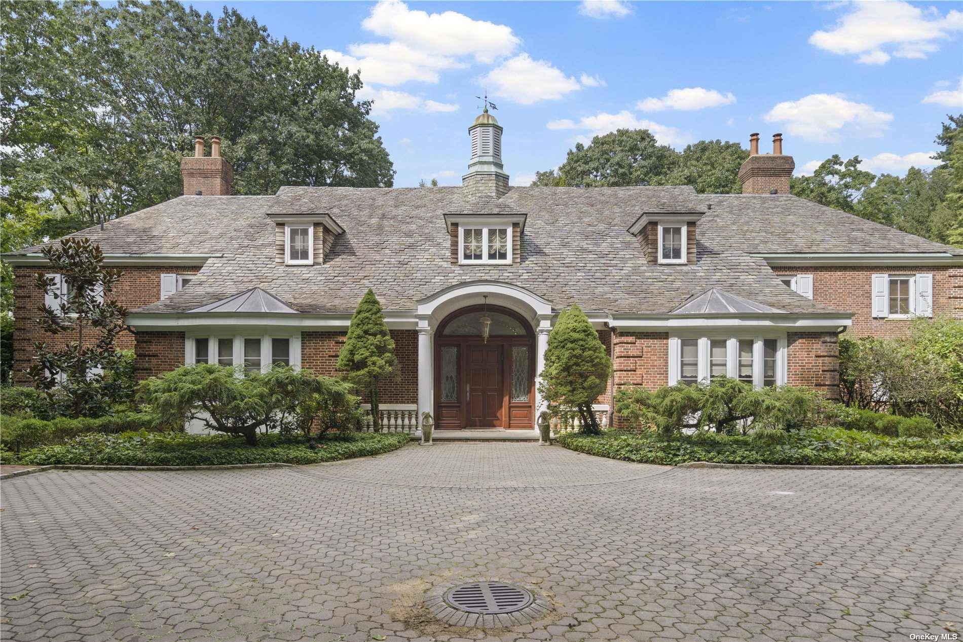 This stunning gated estate in Roslyn, NY sits on 2.