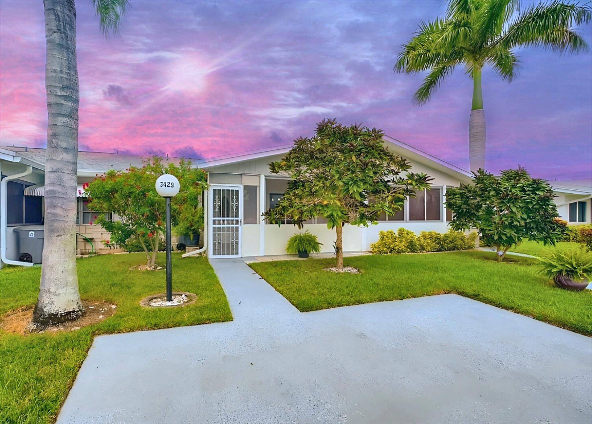 Discover this charming 2 bedroom, 2 bathroom villa in the peaceful Cypress Lakes 55 community.