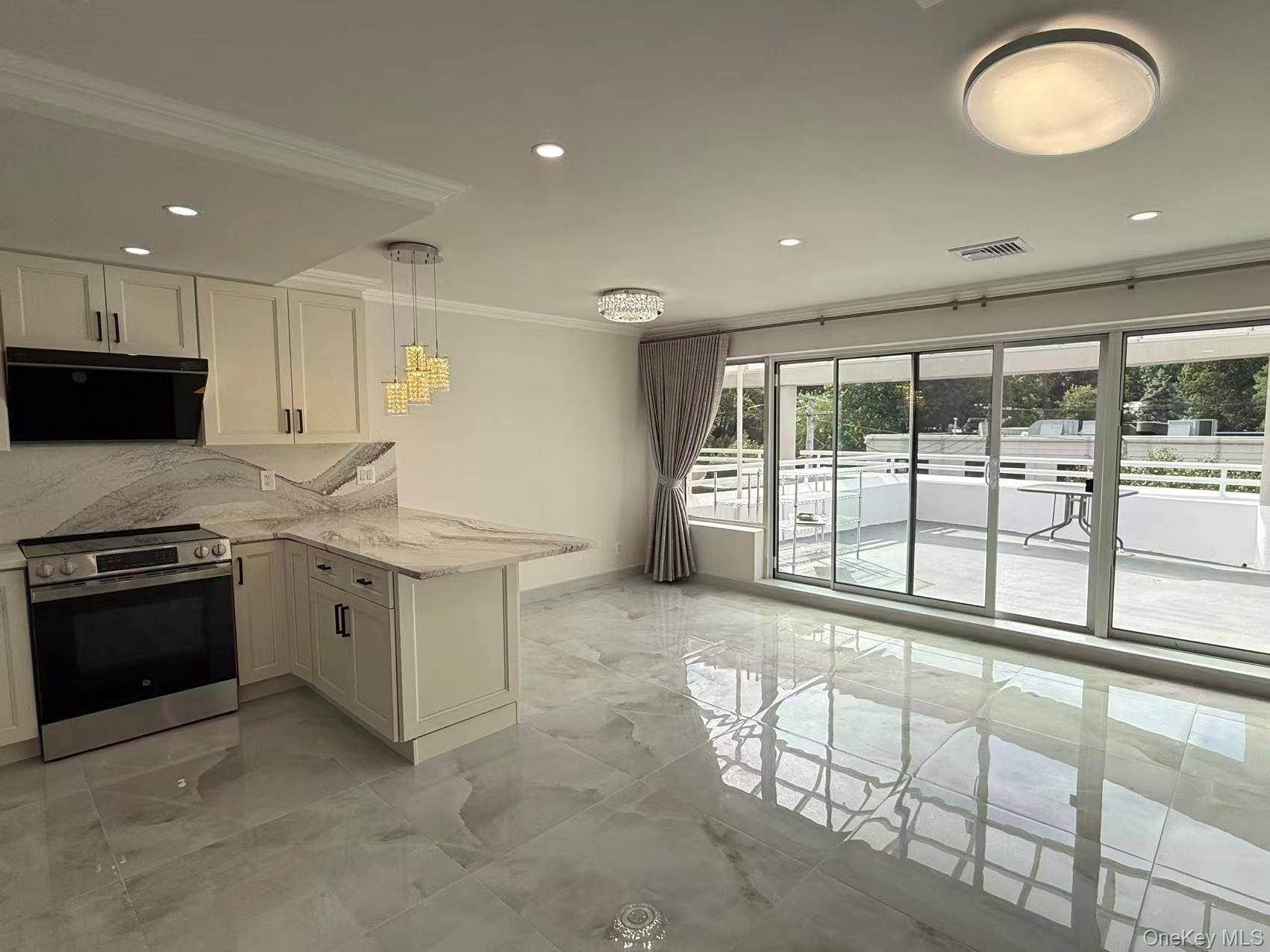 Welcome to this stunning modern duplex condo in the heart of Great Neck, offering both elegance and convenience just moments from town, the LIRR, shops, restaurants, parks, and the library.