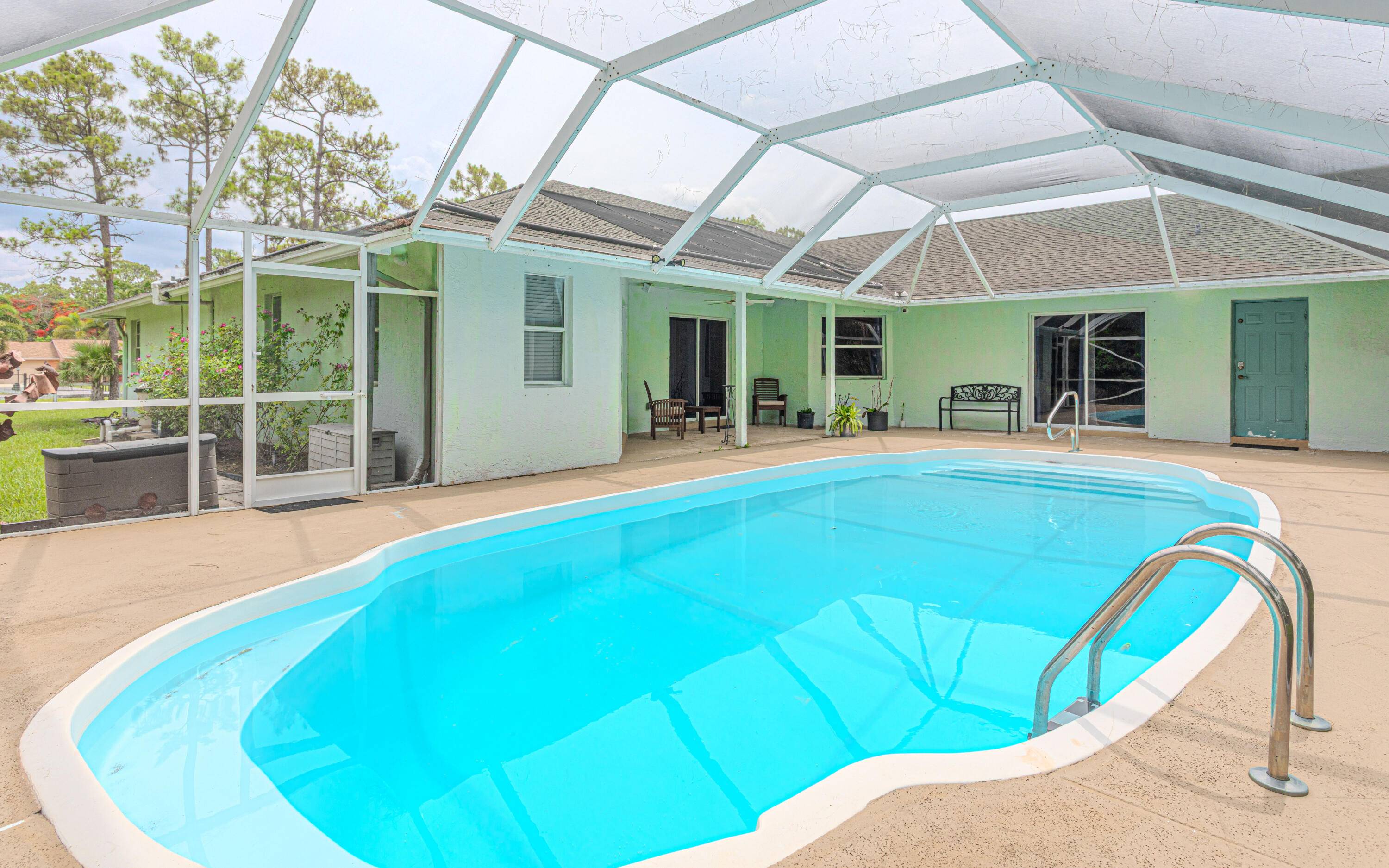 Tucked away in the peaceful surroundings of Loxahatchee, this spacious income producing 5 bedroom, 4 bathroom pool home offers the perfect blend of privacy, versatility, and comfort all on over ...
