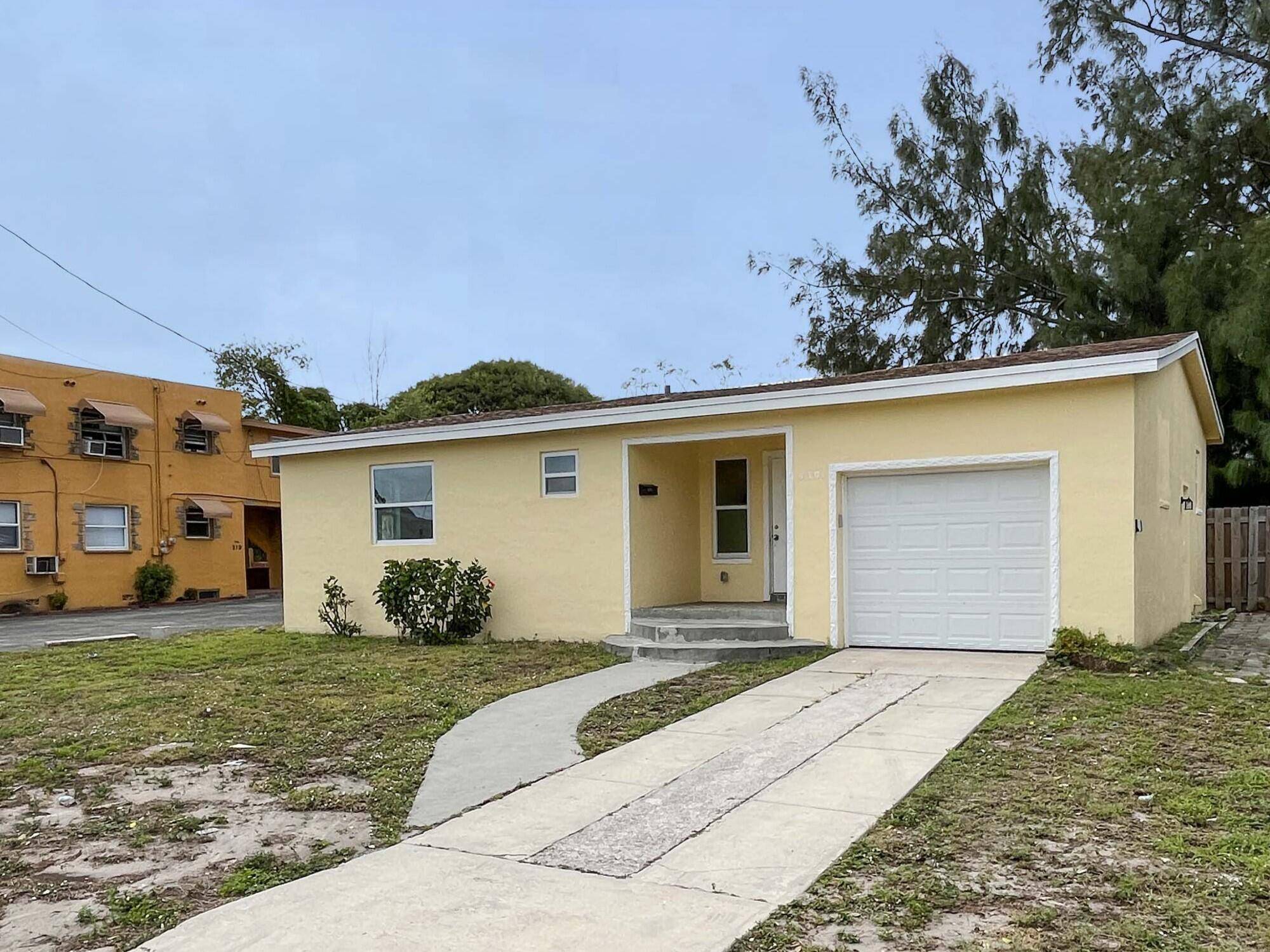 Nicely renovated home with new flooring throughout, stainless steel appliances, spacious yard and one car garage.