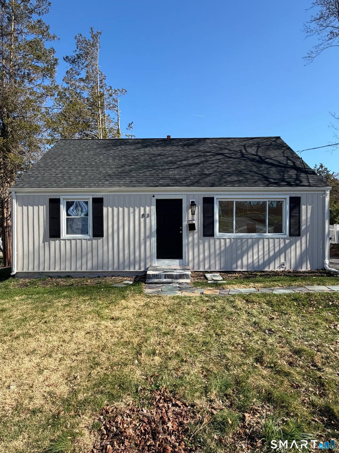 Discover this stunningly renovated Cape Cod home, perfectly situated on a desirable corner lot.