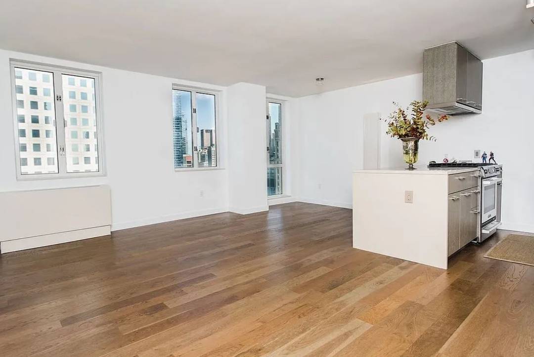 This stunning top floor penthouse overlooks the river and city skyline across the memorial plaza.