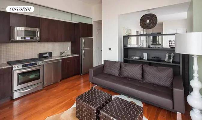 Spacious alcove loft, that can be turned into a one bedroom with a bookshelf separating the living and bedroom areas, in the exclusive icon features soaring 13 ceilings, floor to ...