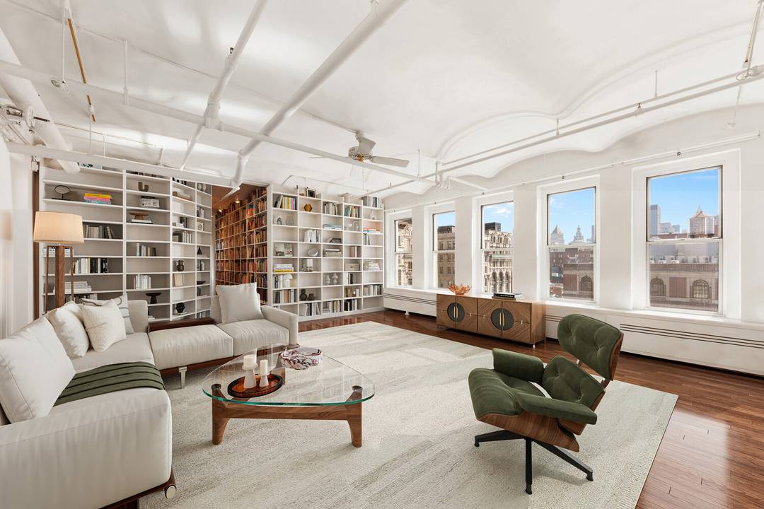 Tucked between Prince and Spring Street on a prime SoHo block, this extraordinary penthouse loft is a luxurious and quiet oasis.