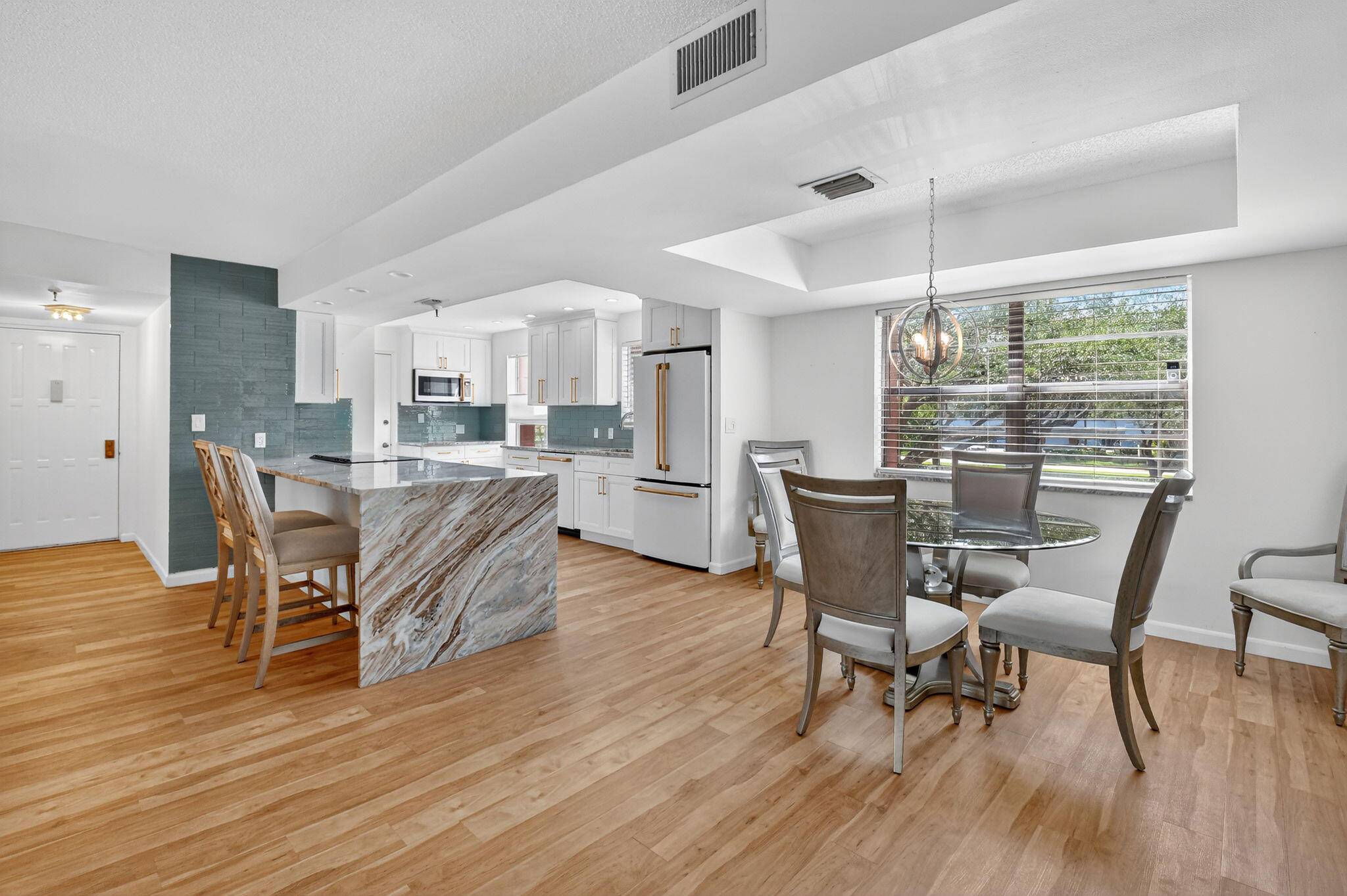 LARGEST unit in The Palms of Boca Tecca is full of natural sunlight has VIEWS of ''Green space LOCATED NEAR BEACHES, I 95, downtown Mizner and Delray's Atlantic Ave.
