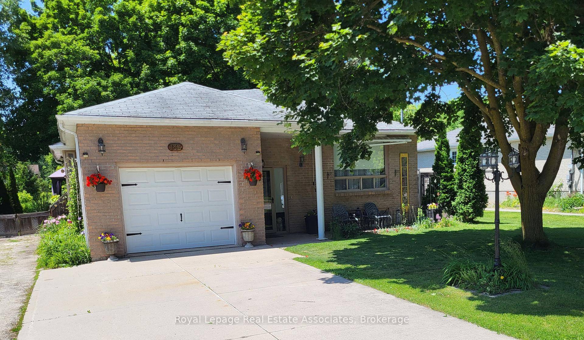 Charming Raised Bungalow on a Huge Half Acre Lot !