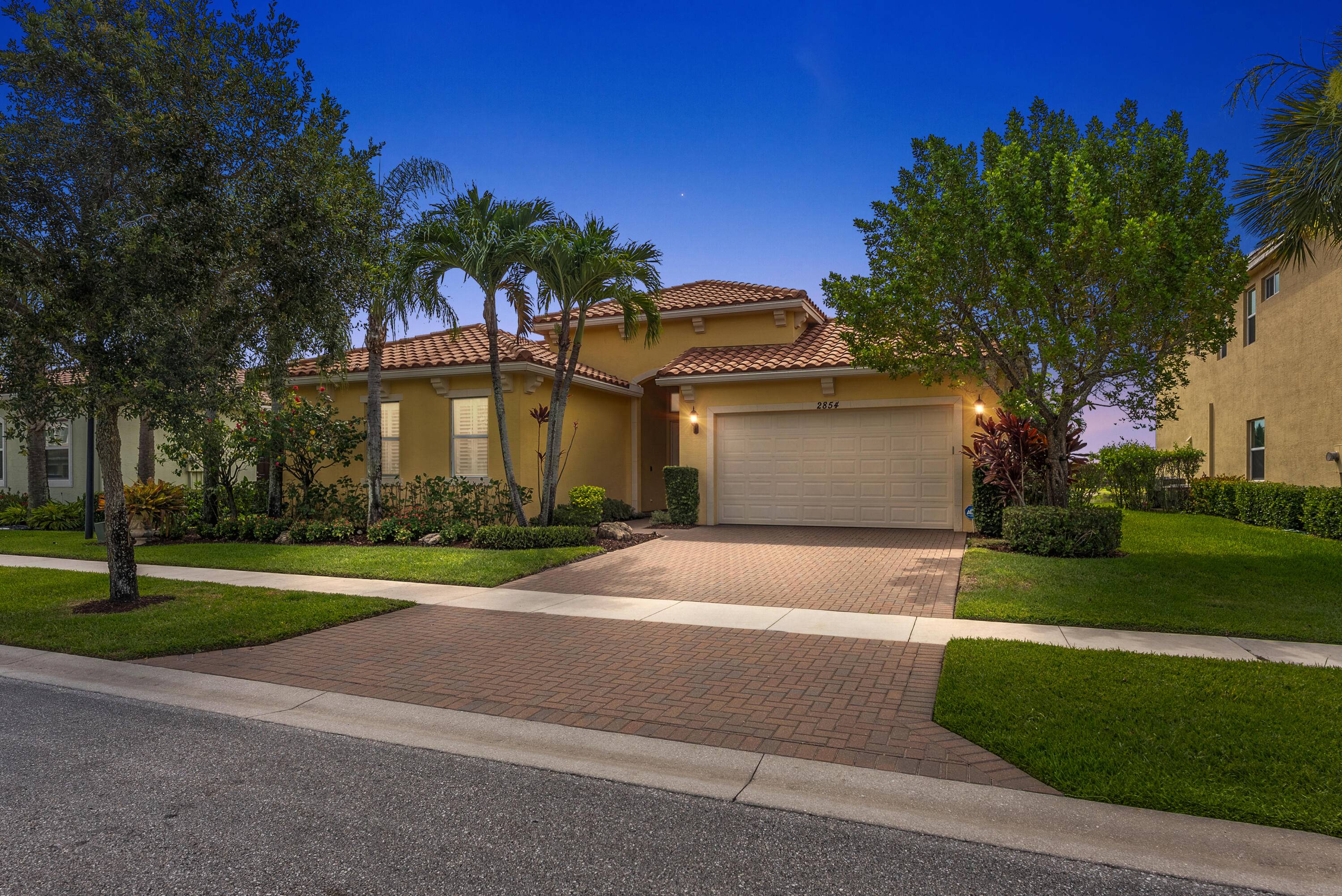 Welcome to 2854 Bellarosa Circle, a stunning residence nestled in the highly sought after resort style community of PortoSol in Royal Palm Beach.