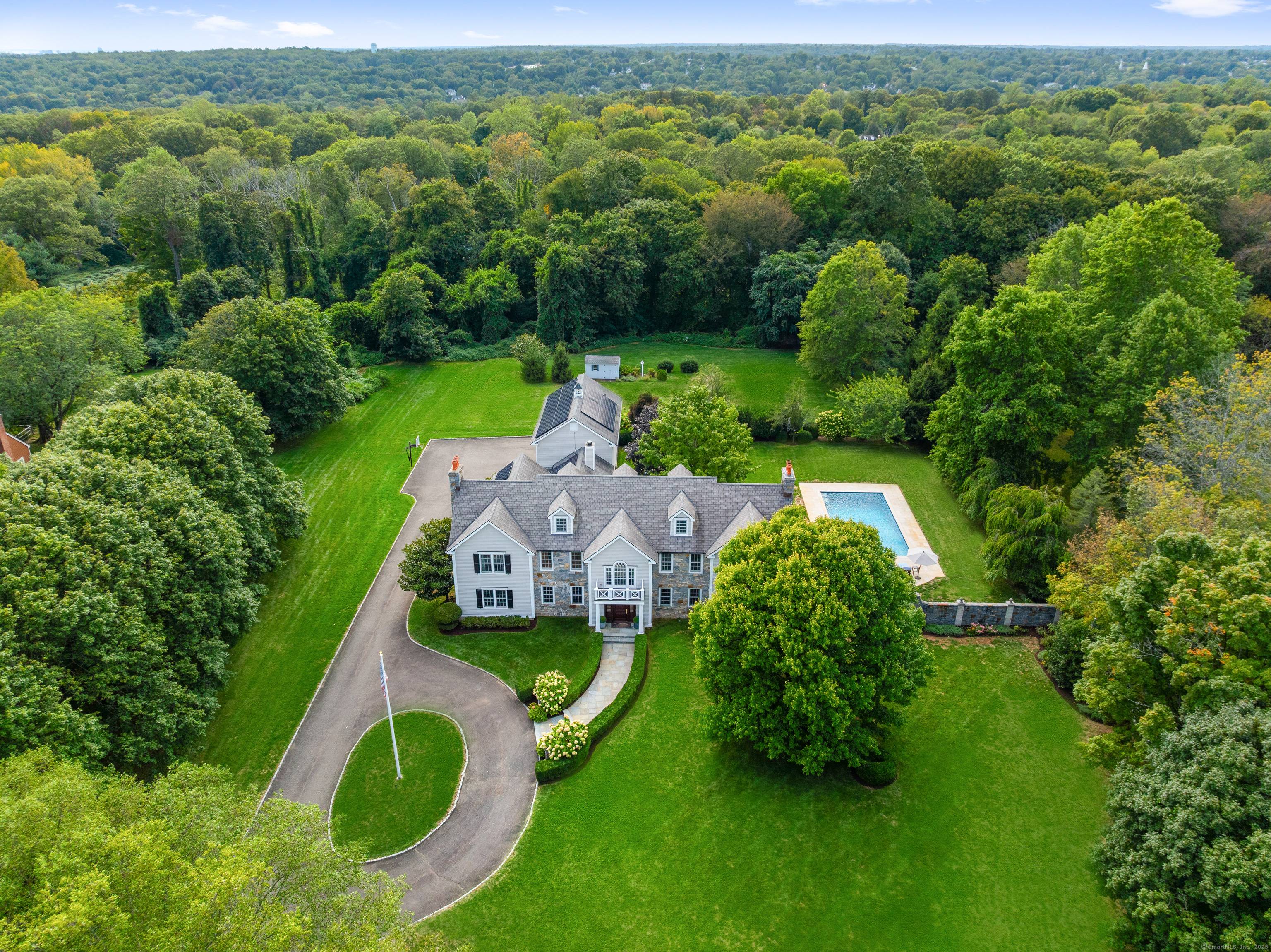 Expanded and fully renovated in 2005, this exceptional Colonial is located in the prestigious Hoyt Farm neighborhood, close to the village.