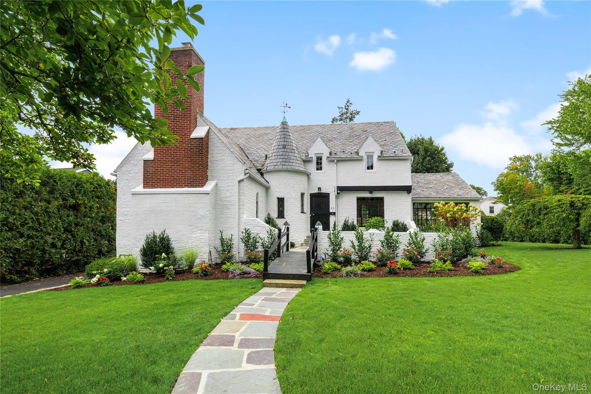 Welcome to 22 Ridge Boulevard, a beautifully renovated Tudor that seamlessly blends timeless charm with modern updates.