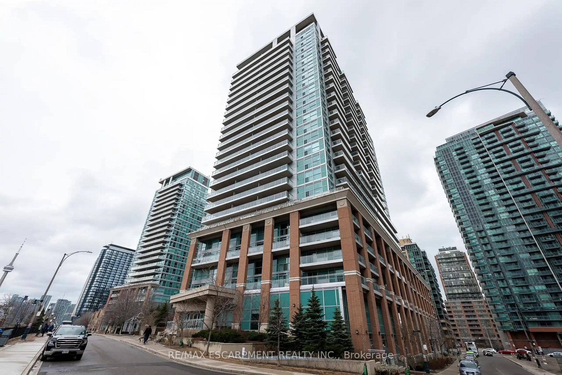 Step into a rare, design forward loft style condo in the heart of Liberty Village, where urban charm meets modern elegance.