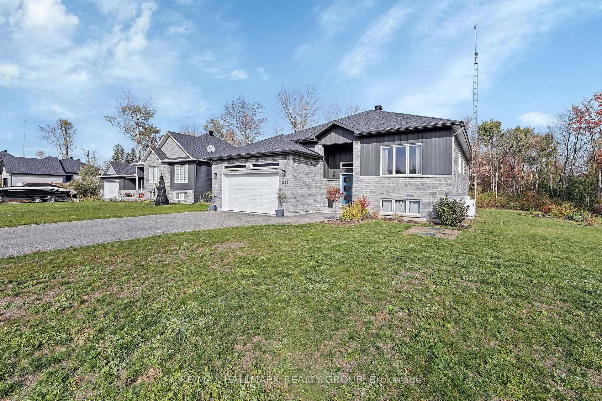 Welcome to 1350 Country Lane a stunning 2022 custom built home nestled on just over an acre of beautifully landscaped property in peaceful North Dundas.