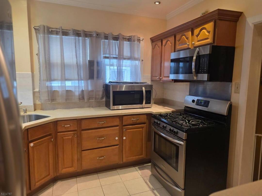 Welcome to 5 Roosevelt Ave, a charming 3 bedroom, 2 bathroom home nestled in the highly sought after Presidential Section of East Orange.