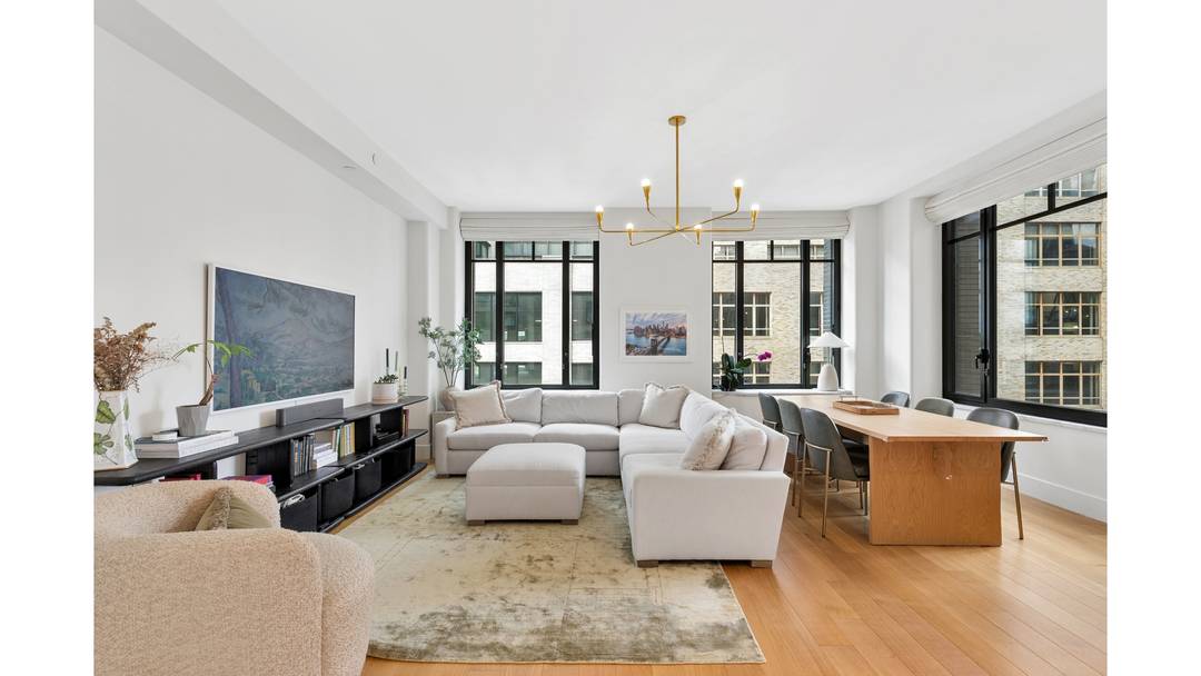 Residence 14D is a beautifully proportioned corner two bedroom, two bathroom condominium with north, west, and east exposures, offering exceptional natural light along with open city and Hudson River views.
