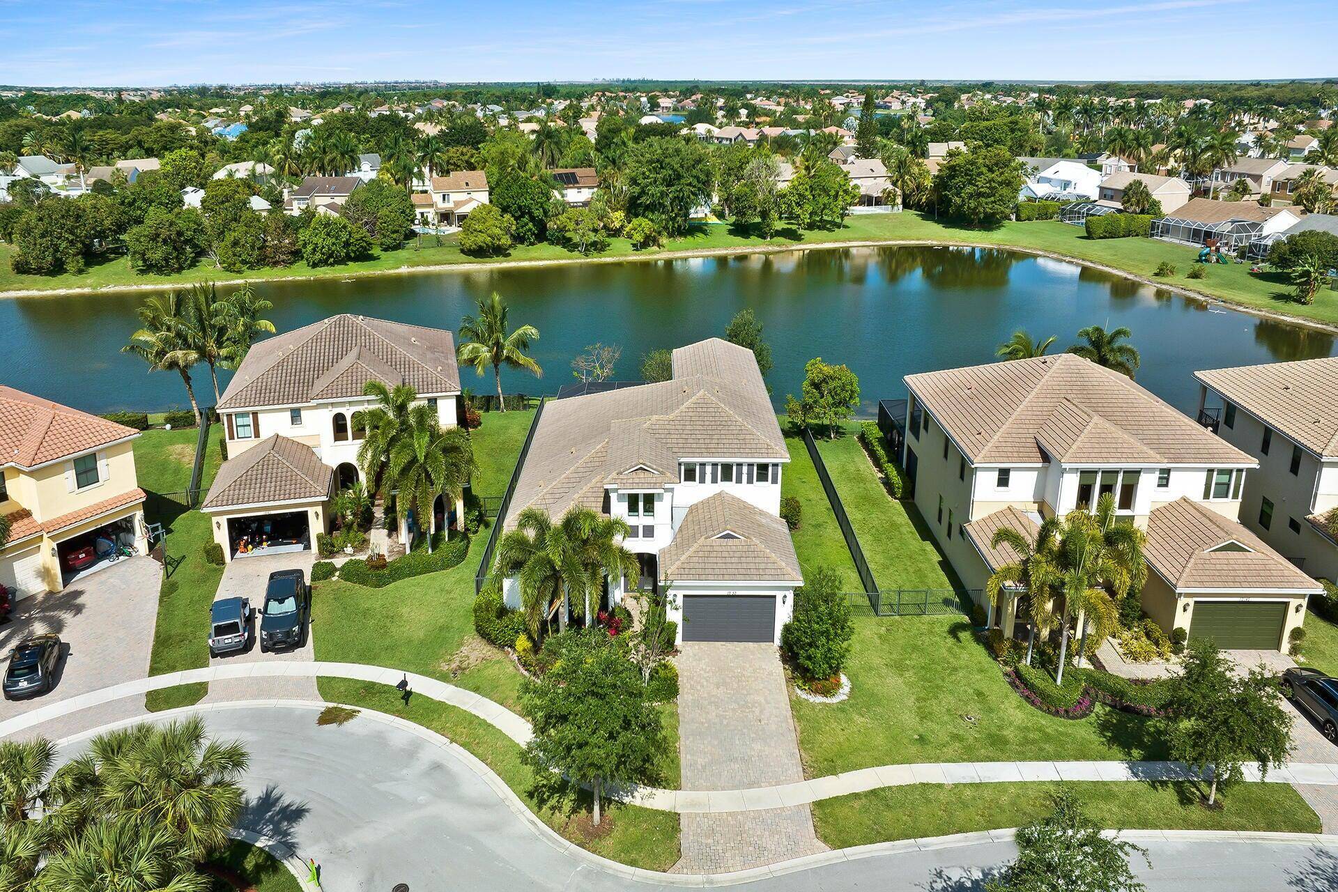 Discover lakefront luxury in the prestigious gated community of Boca Reserve.