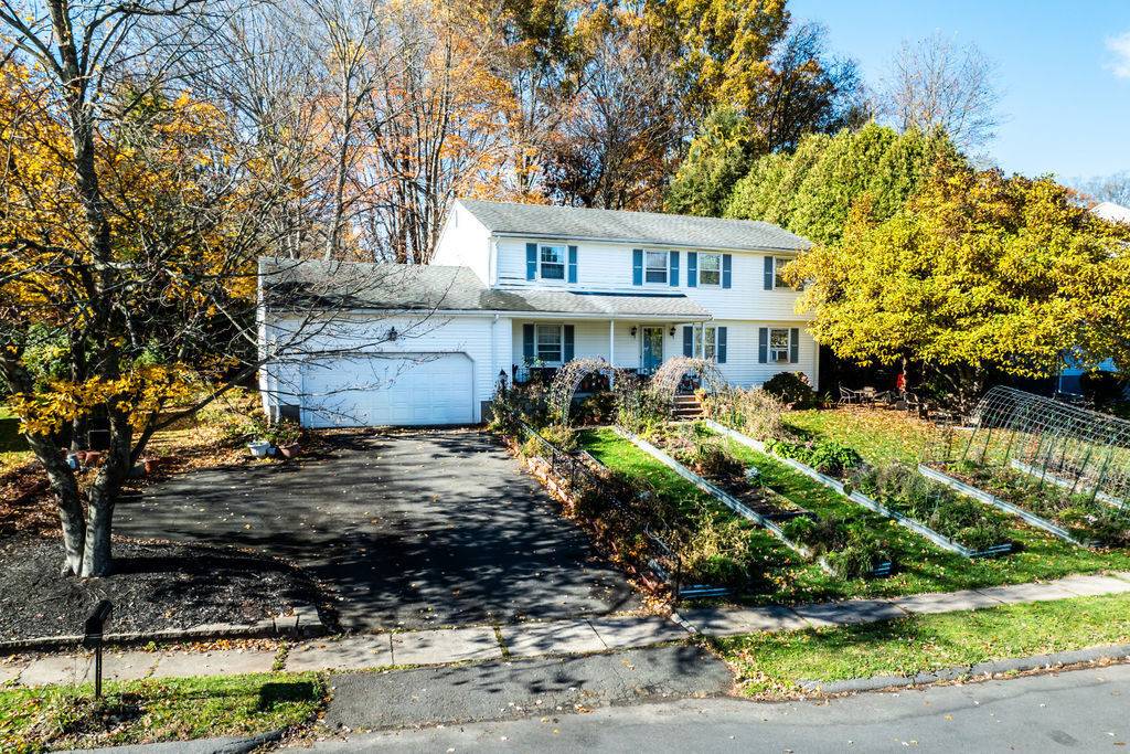 Spacious 5 bedroom Colonial offering tremendous potential !