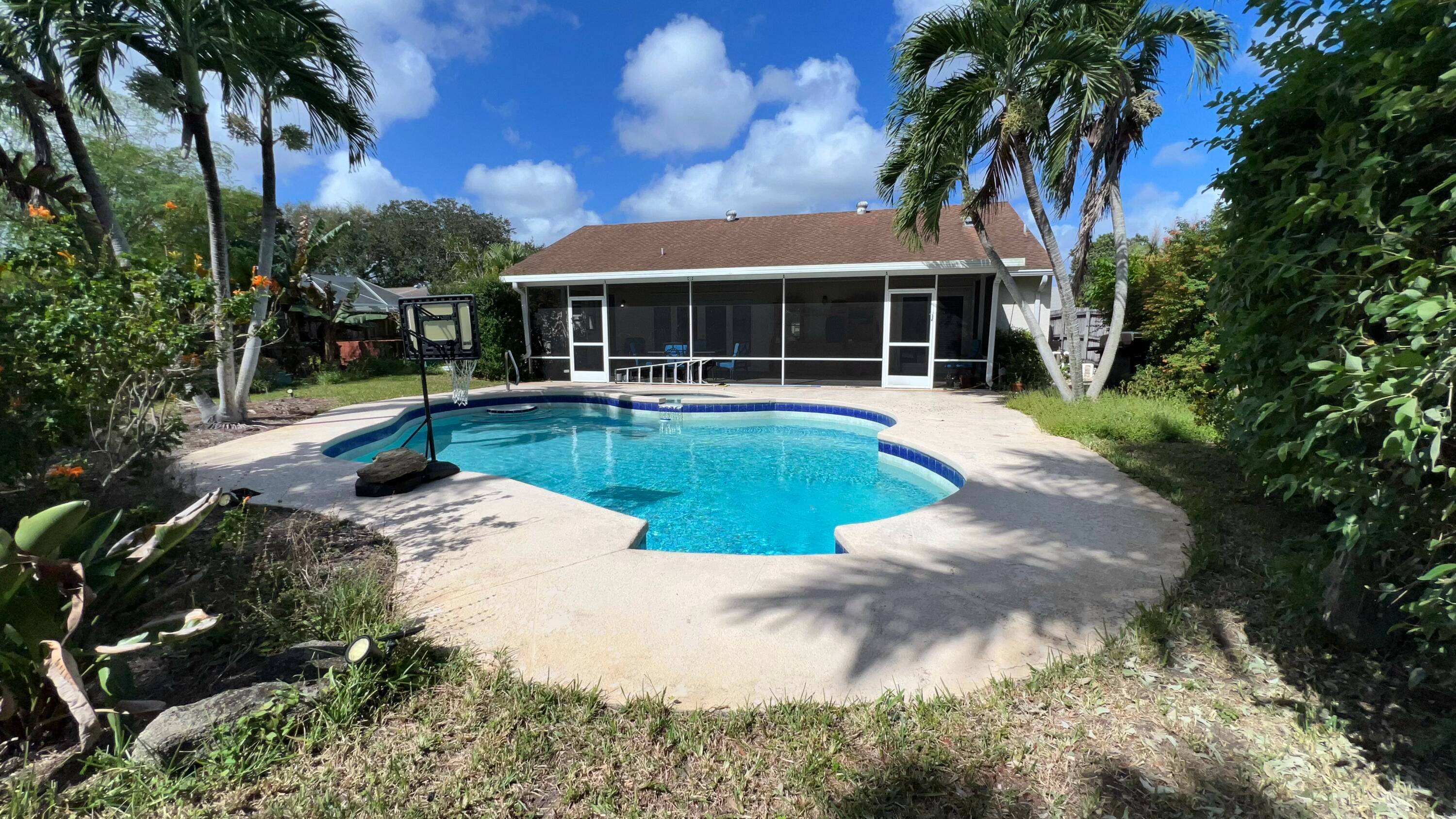 Beautiful 4 Bedroom Home with Pool, Lush Landscaping, and Tranquil Setting.