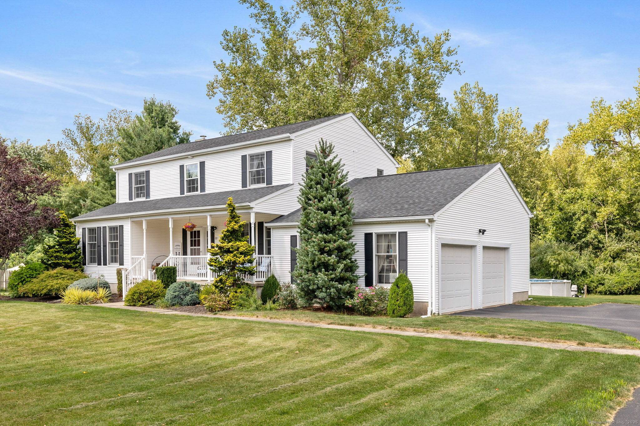 Nestled on a a quiet cul de sac in a sought after neighborhood, this inviting farmhouse style colonial sits on a beautiful level.