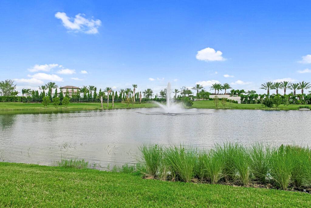 Experience the epitome of Florida living in this brand new Calypso model home, situated on Lot 192 within the prestigious Avenir community.