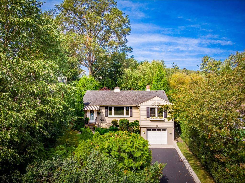 Imagine a Zen retreat with distant river views, set back from the road in a peaceful and picturesque Nyack neighborhood.
