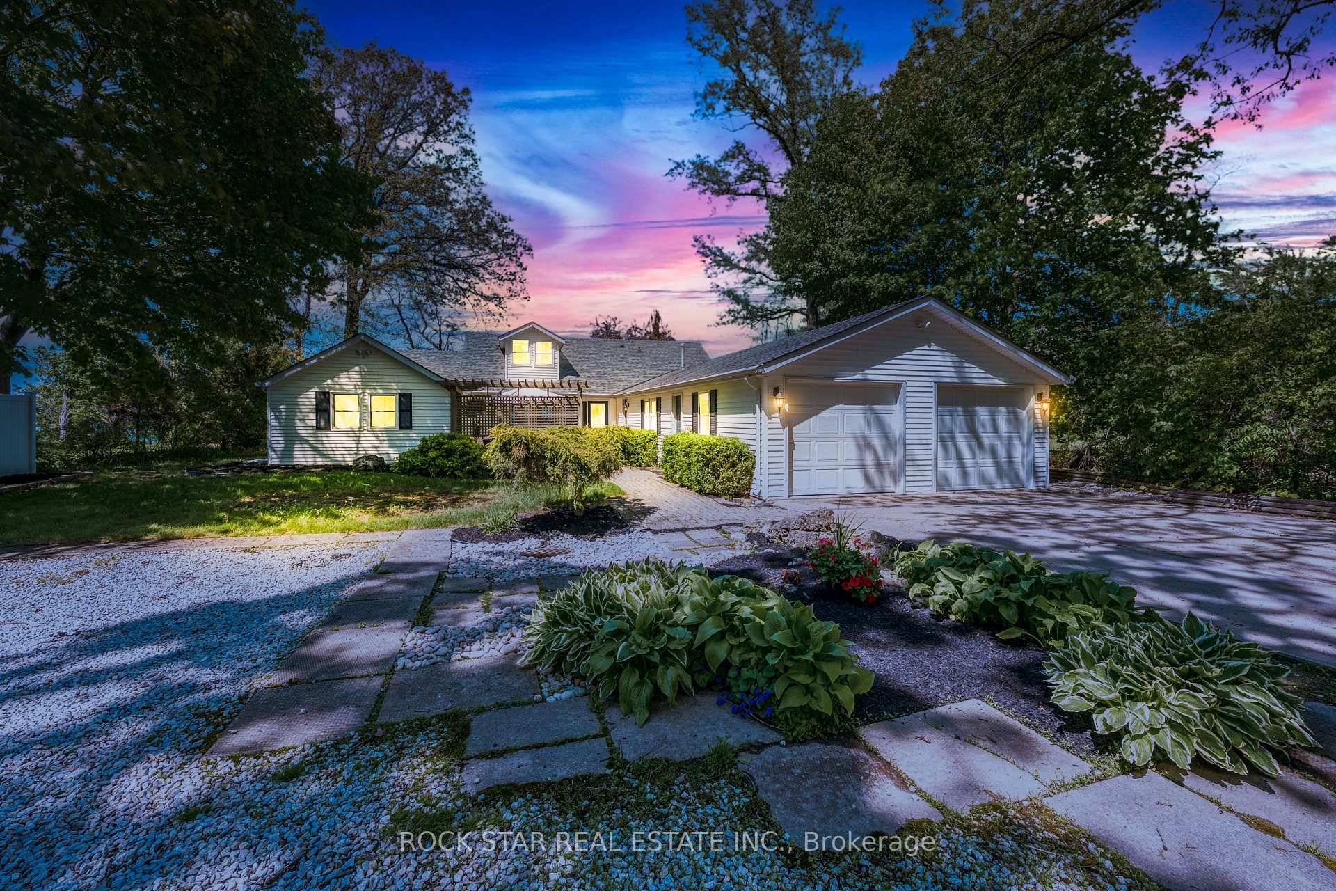 Charming lakefront retreat on 75ft of stunning shoreline overlooking the crystal blue waters of Lake Huron.