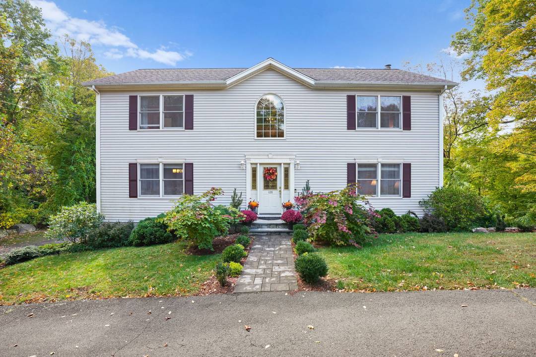 Experience classic New England charm in this beautiful colonial nestled at the bottom of a hill, offering gorgeous lake views from nearly every room.