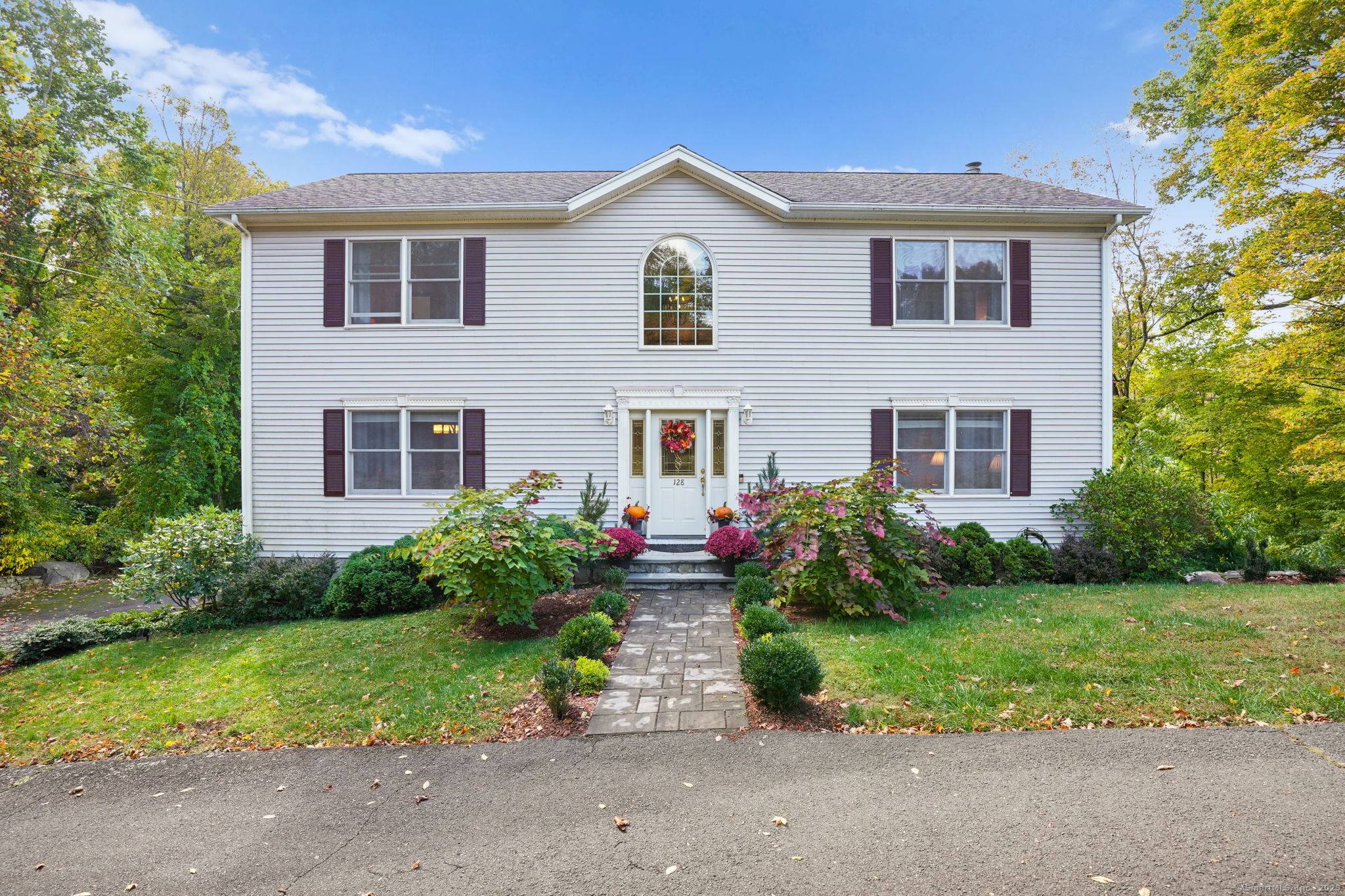 Experience classic New England charm in this beautiful colonial nestled at the bottom of a hill, offering gorgeous lake views from nearly every room.