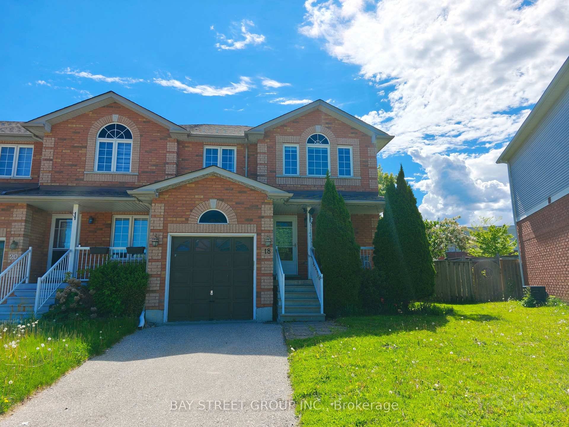 Beautifully updated end unit 3 bedroom freehold SEMI townhouse on a rare pie shaped lot with no neighbours on side or back.