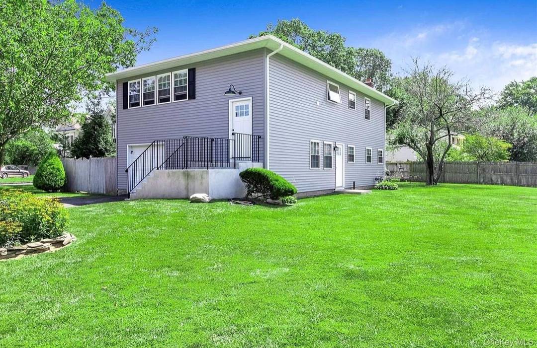 Beautiful 3 bedroom rental featuring a large living room with balcony, kitchen with an island, laundry, and dishwasher.