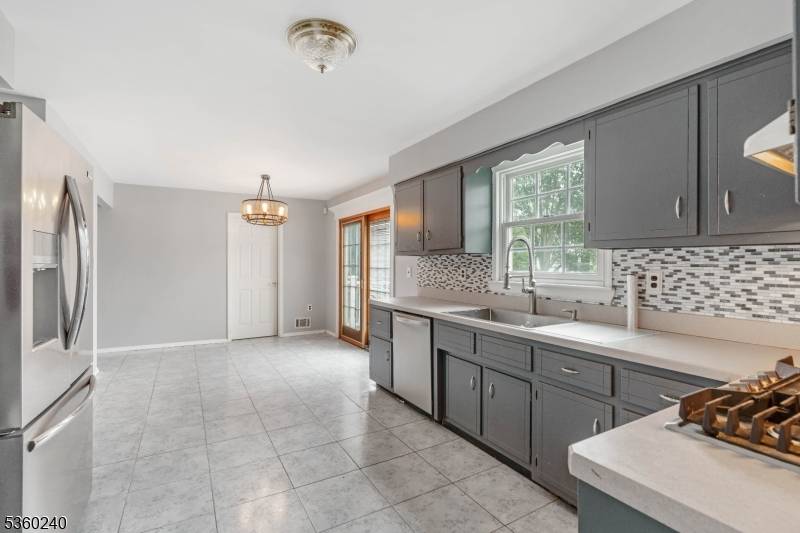 Welcome to this delightful four bedroom, three bathroom home nestled in the sought after Hamilton Estates section of Rahway.