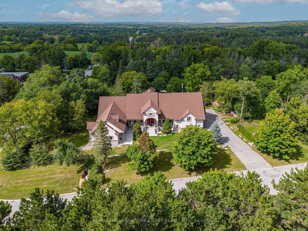 Step beyond the ordinary and into an architectural opus a custom estate of approx.