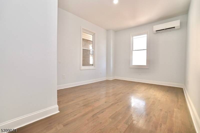 A must see, Weequahic Section newly renovated two family home offering two large duplex style apartments withgenerous living space throughout.