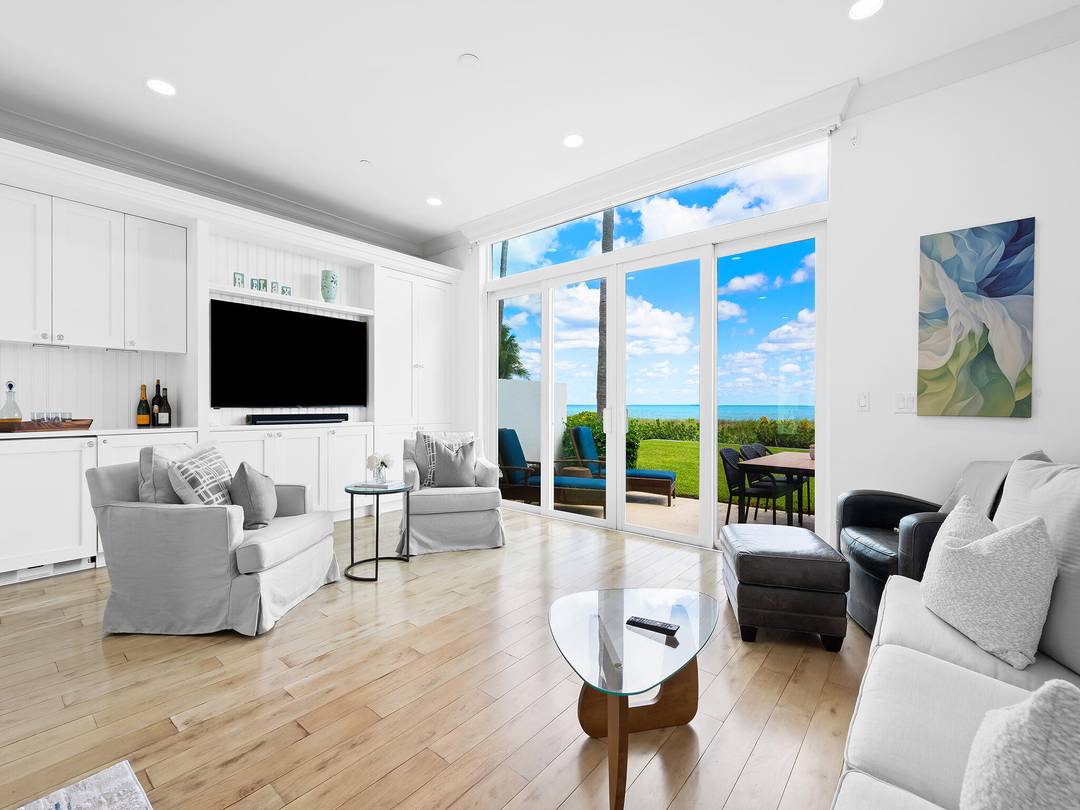 The Sunrise Awaits ! This Direct Ocean private Townhome is a two story residence situated right on the sand, facing the Beach and Ocean !