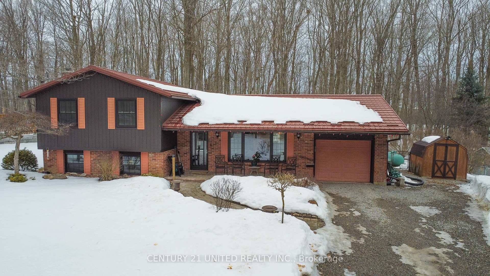 Nicely appointed brick cedar sided, 3 bedroom side split nestled in a quiet, preferred rural location.