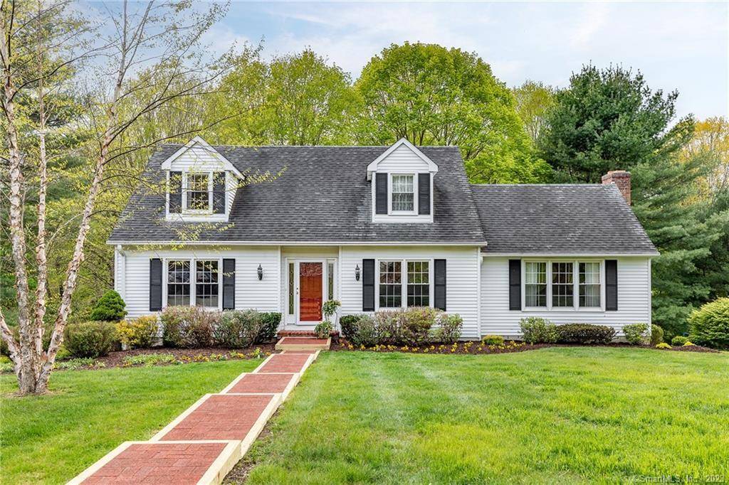 A pristine Connecticut cape with professional landscaping set on just under 1 acre on a well maintained cul de sac.