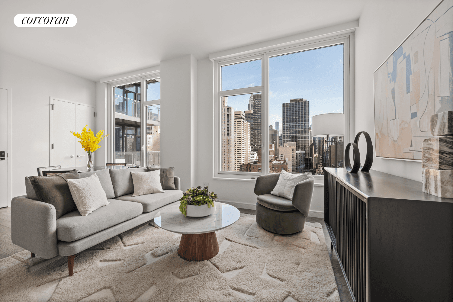 Welcome to Residence E, a corner unit two bedroom two bathroom facing north, east, and south that embodies modern luxury and sophistication.