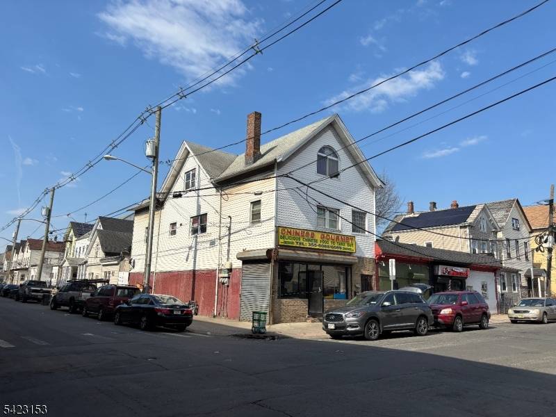 Fully Rented Mixed Use Corner Property.