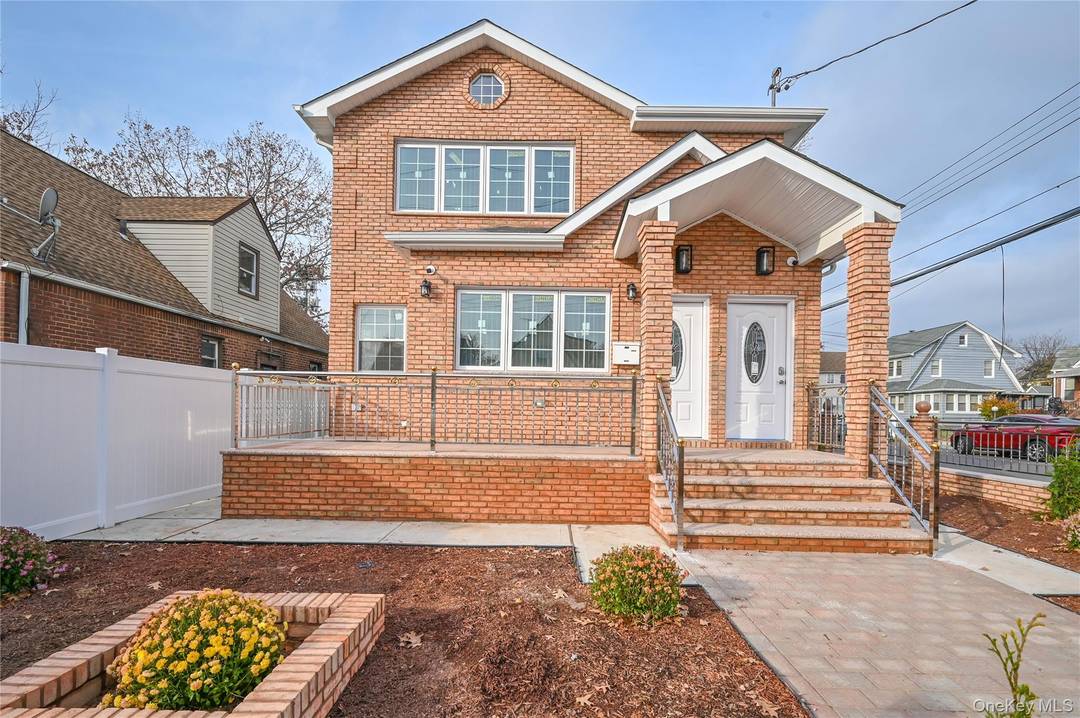 Large Beautiful 2 Family New Construction on Corner Lot with Matte Brick and Design Stainless Fence with 3 Gates.
