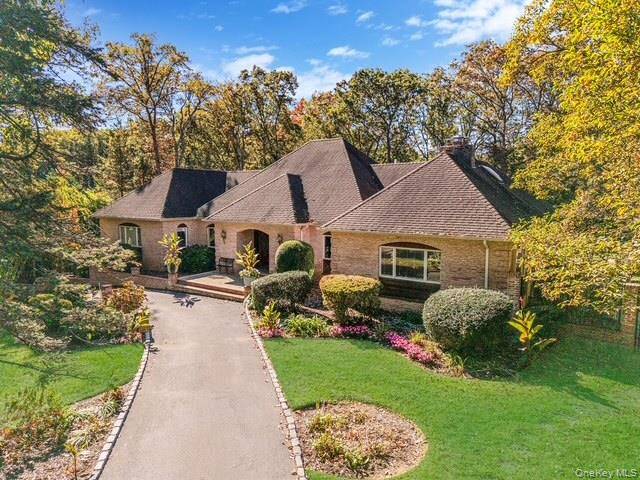 Experience refined living in this stunning 5 bedroom, 5 bath expanded ranch, perfectly situated in one of Dix Hills most sought after neighborhoods.