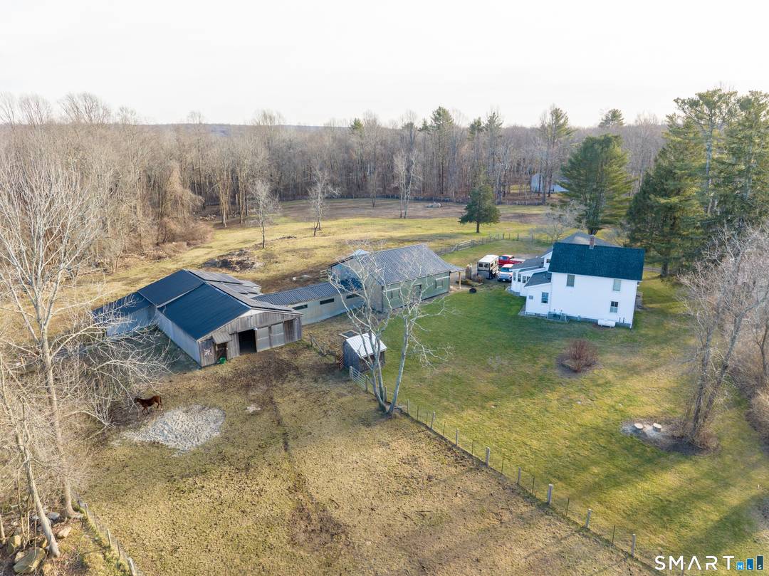 Fabulous Horse property with charming 4 bedroom Farmhouse and 6 stall barn all on 10 meticulously maintained pasture like fenced acres with a pond.