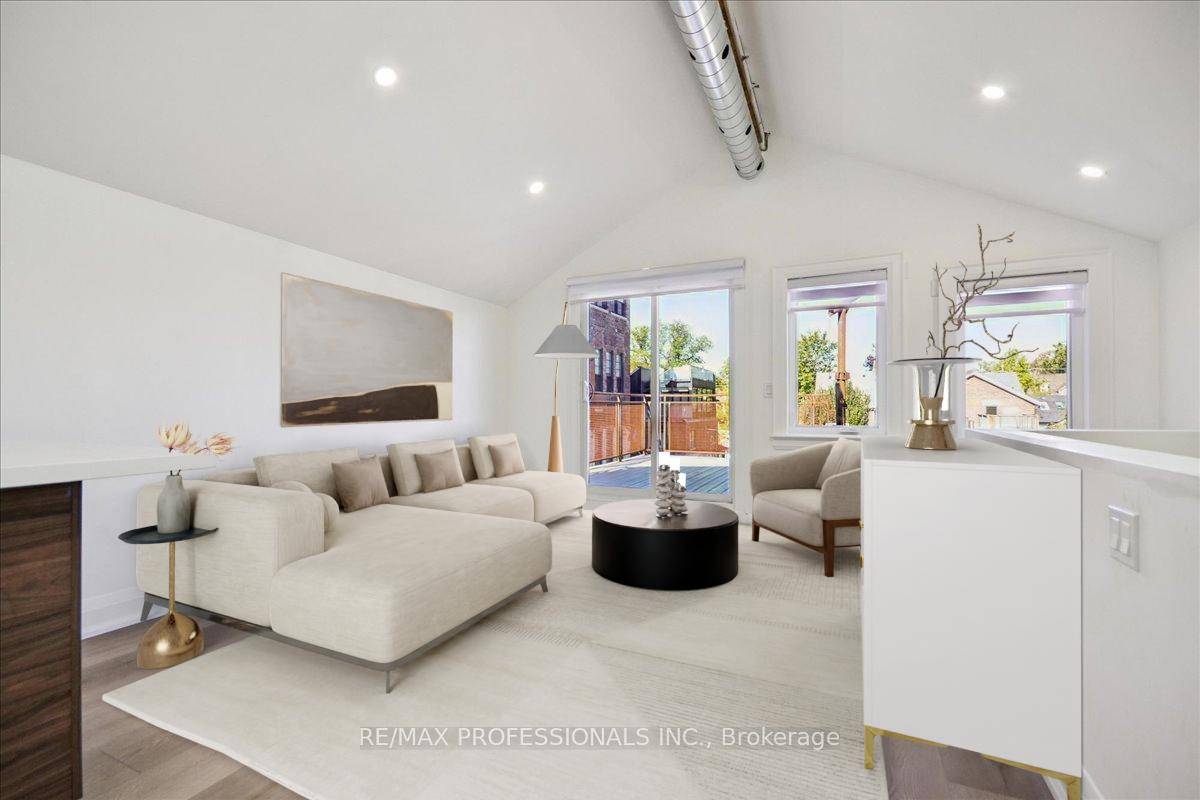 Live above it all in this sunlit, top floor apartment featuring soaring cathedral ceilings, a spacious north facing deck, and a perfect balance of character and comfort.