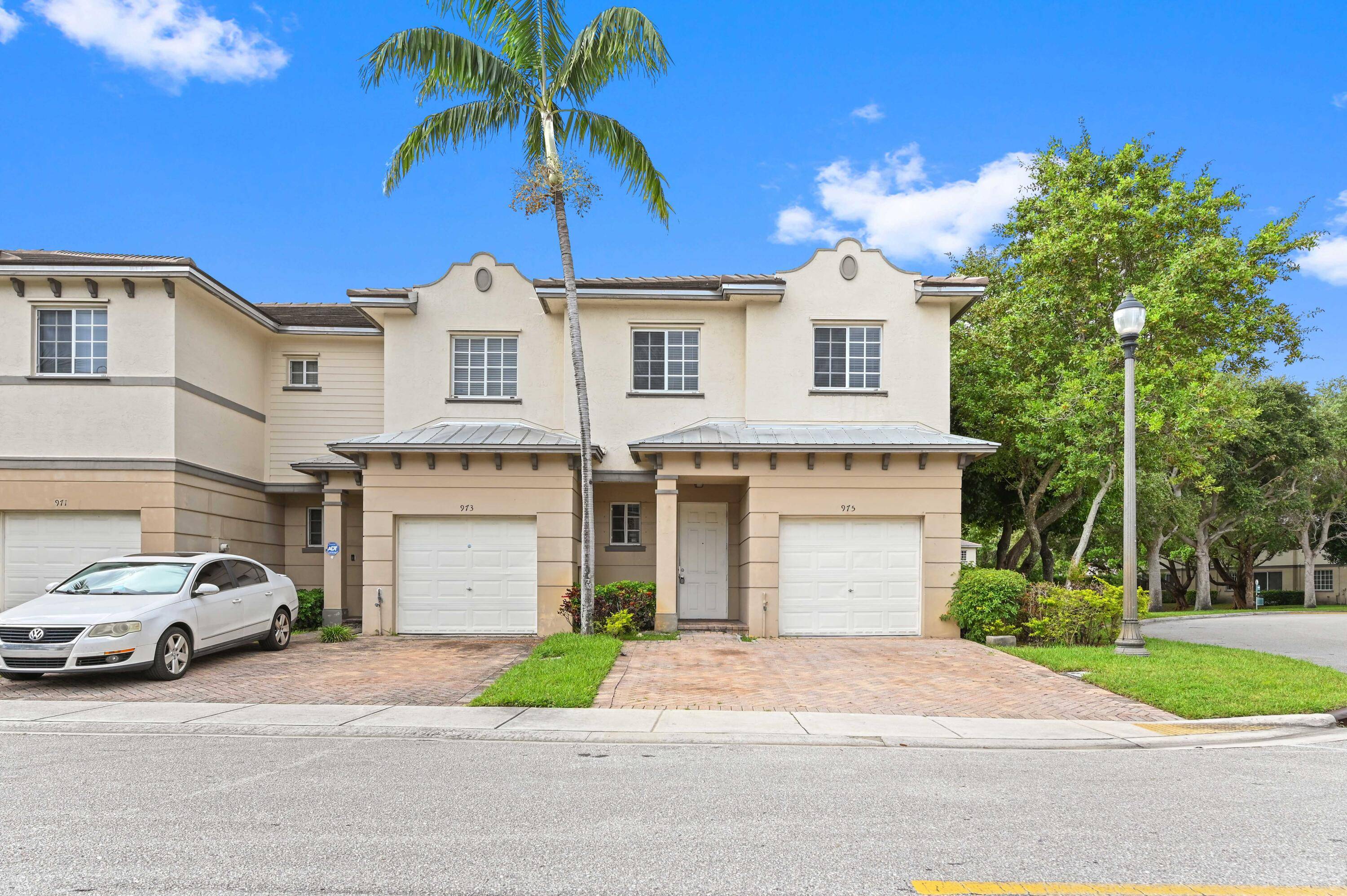 Welcome to this move in ready corner townhouse boasting an incredible, serene setting directly on the water.