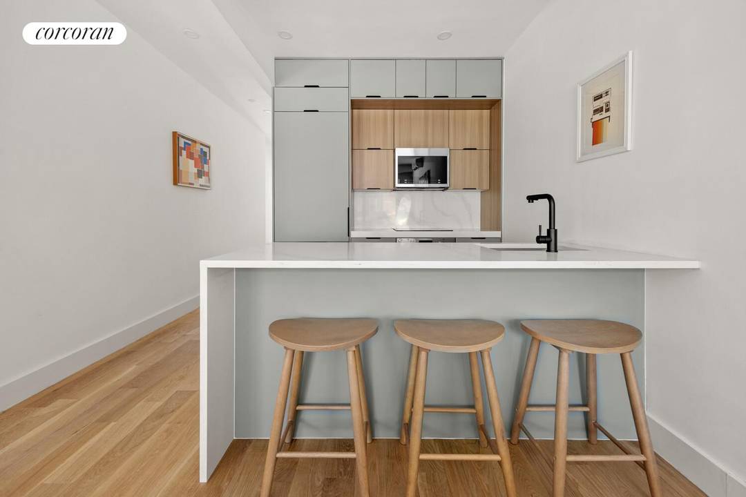 Residence 3 at 157 Rogers Avenue is a thoughtfully designed two bedroom, two bathroom home spanning 931 square feet, offering a seamless balance of warmth, functionality, and modern design.