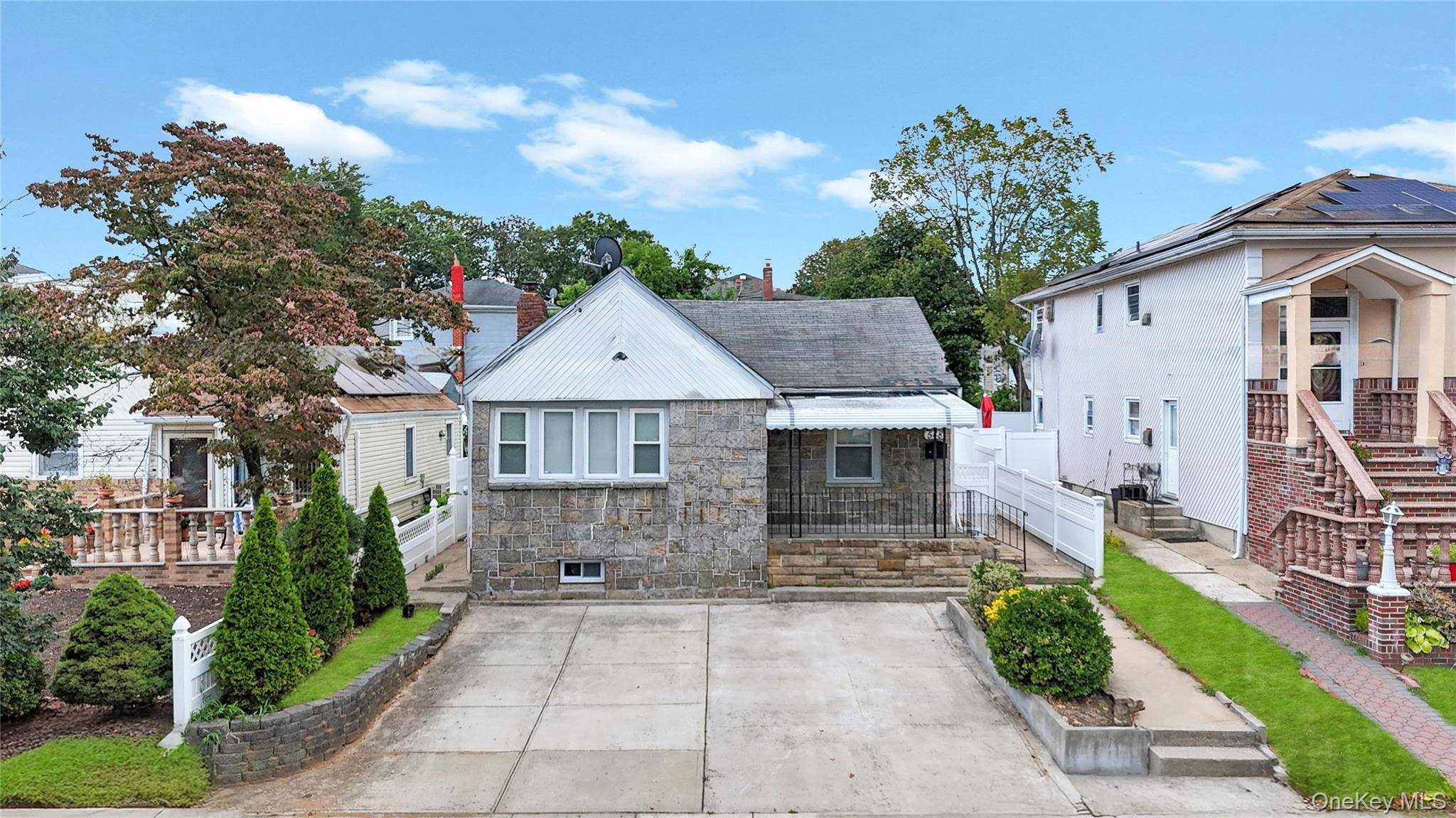 Welcome to this beautifully maintained Classic Ranch in Elmont, boasting 3 bedrooms, 3 full bathrooms, and a fully finished basement with a private outside entrance.