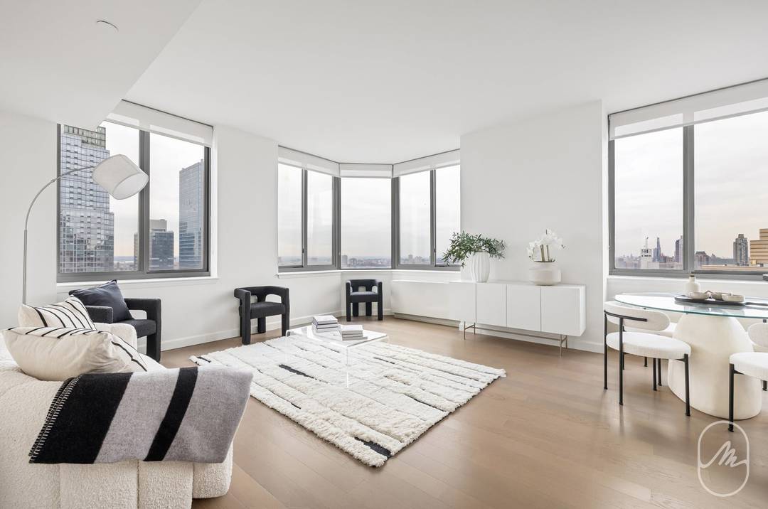 Sprawling double corner, two bedroom, two bathroom with walls of bay windows and expansive views now available.