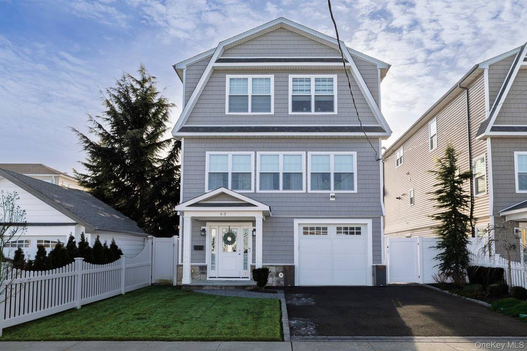 This stunning contemporary home, built in 2020, features an open floor plan with luxurious details throughout.