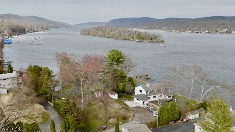 Experience elevated lakefront living in this stylish townhouse overlooking Greenwood Lake.