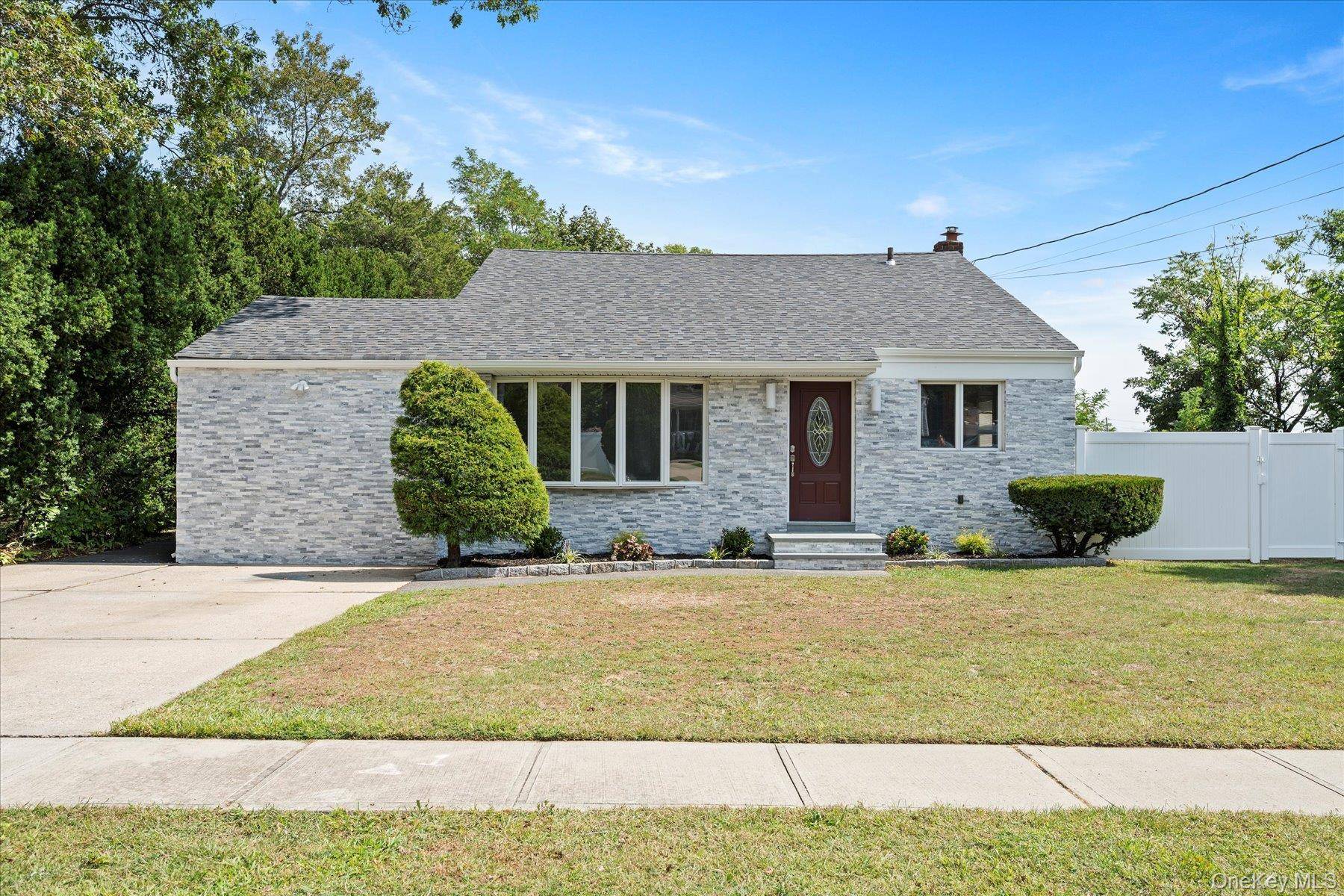 Beautifully renovated and spacious multi split home in the highly sought after Half Hollow Hills School District.