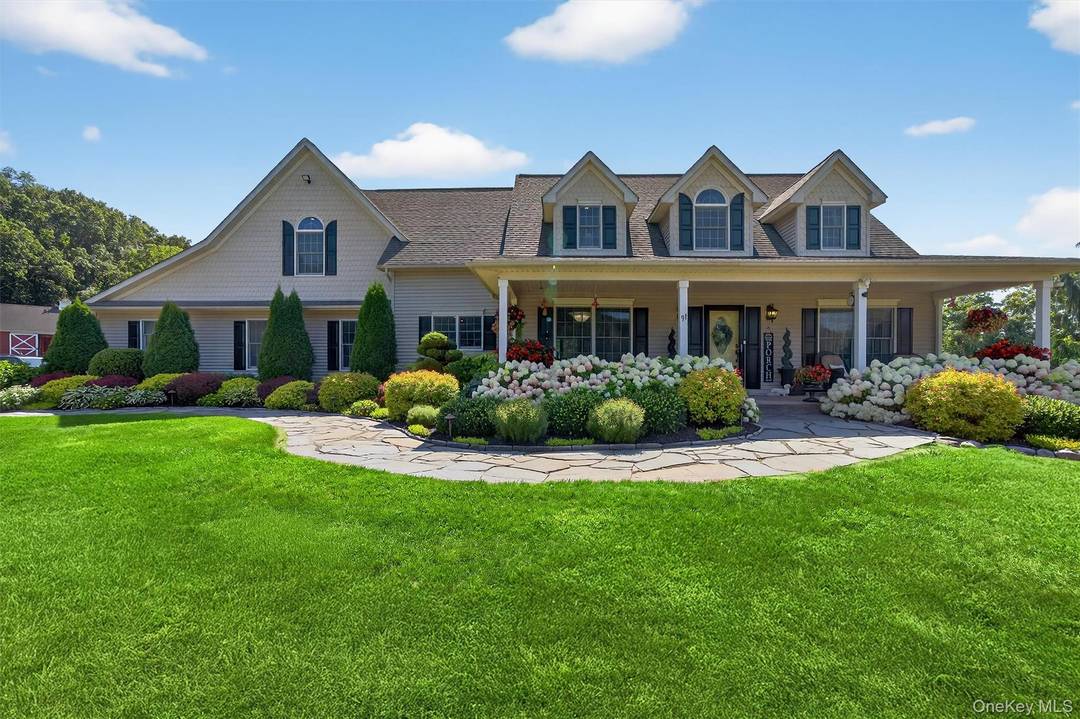 Welcome to this beautifully landscaped, custom crafted Cape Cod home nestled on 5.